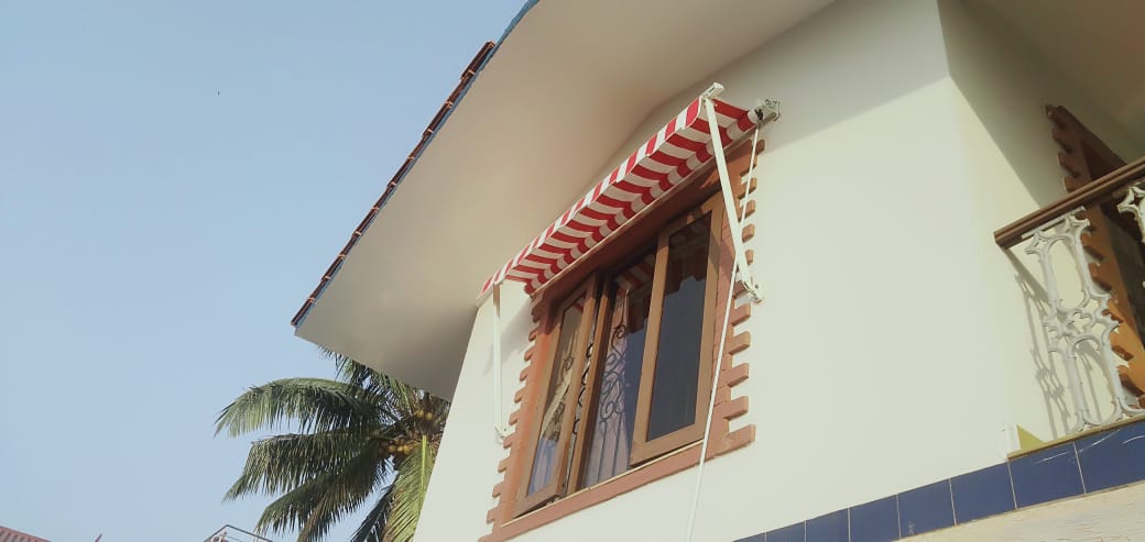 Drop arm awning folded